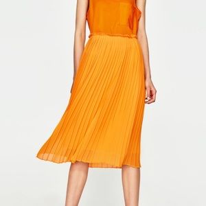 Tangerine Pleated Midi Skirt Size XS/ Never worn